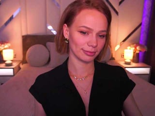 Webcam Belle - shyysiren redhead vixen she takes her sexy lingerie set off and even rubs her shaved pussy to taste her own love juices online