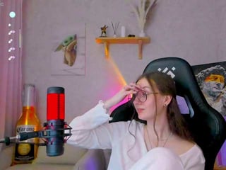 Webcam Belle - -lovely redhead vixen she takes her sexy lingerie set off and even rubs her shaved pussy to taste her own love juices online