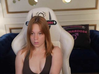 Webcam Belle - sandrasunrise redhead vixen she takes her sexy lingerie set off and even rubs her shaved pussy to taste her own love juices online